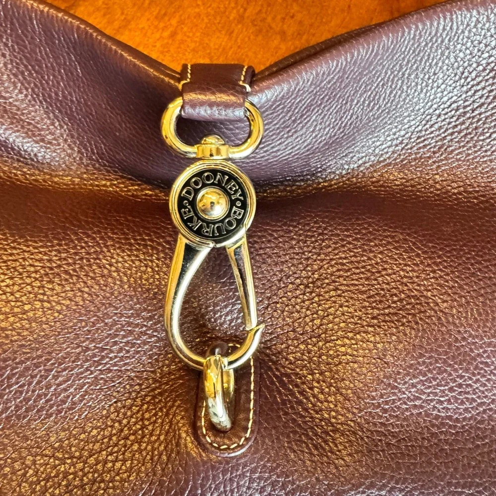 Dooney & Bourke Leather Hobo Handbag Plum Wine Purple Shoulder‎ Bag Archive logo